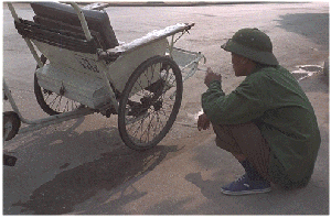 Rickshaw driver, Vietnam.